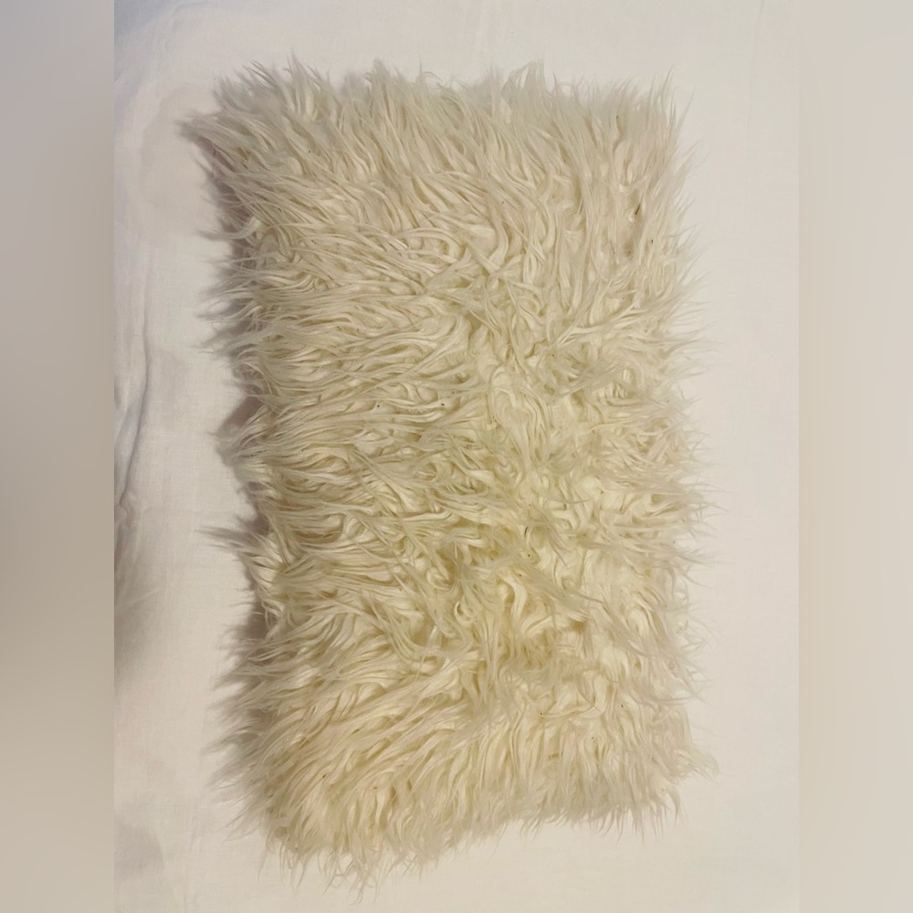 Furry cream throw pillow